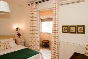 A bed or beds in a room at Katerina's Luxury Apartment