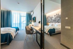 Voodi või voodid majutusasutuse Hotel HegiQ - Adults Only Hotel toas