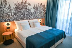 Voodi või voodid majutusasutuse Hotel HegiQ - Adults Only Hotel toas