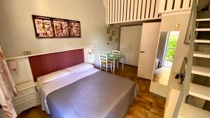 Postel nebo postele na pokoji v ubytování Residence Al Lago