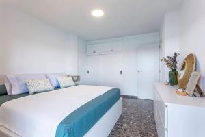 Posteľ alebo postele v izbe v ubytovaní Apartamento El Palmer