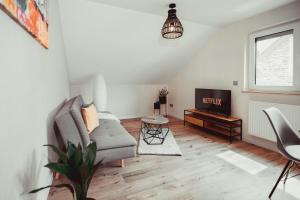 Posezení v ubytování Exklusive Ferienwohnung an der Mosel - Top Ausstattung - Dachterrasse - E-Ladestation - Netflix