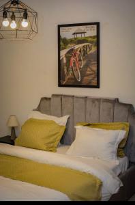 Ένα ή περισσότερα κρεβάτια σε δωμάτιο στο Appartement cosy goldy bonapriso