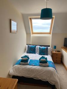 Postel nebo postele na pokoji v ubytování Apartment 2, Craigmore, Upper Baila, Lerwick
