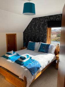 Llit o llits en una habitació de Apartment 2, Craigmore, Upper Baila, Lerwick
