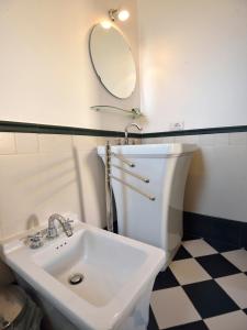 a bathroom with a sink and a mirror at Tenuta Orsanese in Ginosa Marina