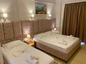 Postel nebo postele na pokoji v ubytování Karos Hotel Llaman