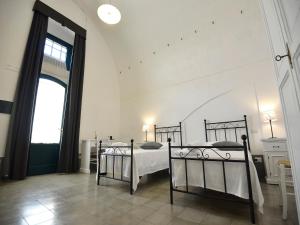 A bed or beds in a room at Tenuta Orsanese