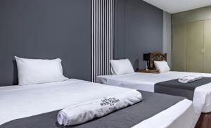 Ένα ή περισσότερα κρεβάτια σε δωμάτιο στο Hotel Taurus