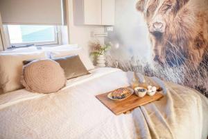 Ένα ή περισσότερα κρεβάτια σε δωμάτιο στο Ecohome Veer - Zeezand Recreatie +27 φωτογραφίες