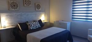 Postel nebo postele na pokoji v ubytování Apartamento Los Arcos
