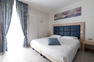 Postel nebo postele na pokoji v ubytování Albergo Monte Giove