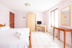 Postel nebo postele na pokoji v ubytování Albergo Monte Giove