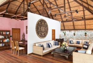 a living room with a couch and a table at Kata Ocean View condominium by Lofty in Kata Beach