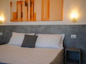 Postel nebo postele na pokoji v ubytování Hotel Rivabella