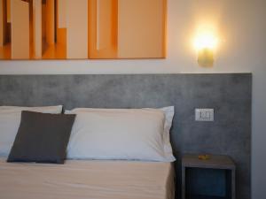 Postel nebo postele na pokoji v ubytování Hotel Rivabella