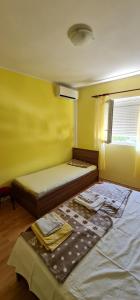 Postel nebo postele na pokoji v ubytování Villa Rab Robert