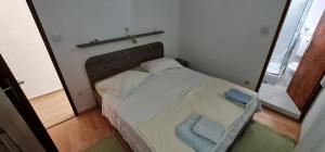 Postel nebo postele na pokoji v ubytování Villa Rab Robert