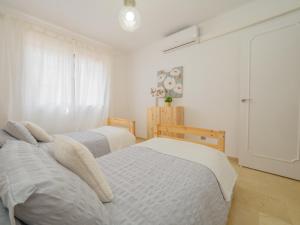 Postel nebo postele na pokoji v ubytování Cubo's Apartamento Las Acacias Beach + 28 fotografií