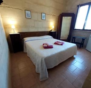 Postel nebo postele na pokoji v ubytování B&B La Nicchiarica