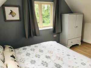 a bedroom with a bed and a window at Rural Apartment near Spalding 1 bed in Spalding