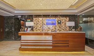 a lobby of a hotel with a reception desk at Treebo Tryst Arista in Chandīgarh