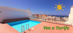 a swimming pool on the roof of a house at Bendito Viento in Tarifa +8 photos