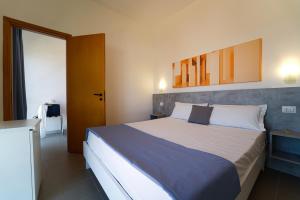 Postel nebo postele na pokoji v ubytování Hotel Rivabella