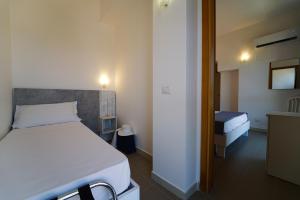 Postel nebo postele na pokoji v ubytování Hotel Rivabella