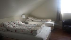 Tempat tidur dalam kamar di Gerdi Guesthouse