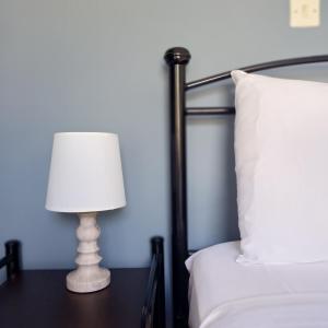 A bed or beds in a room at Μπουκαμβίλια - Bougainvillea