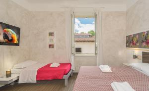 Postel nebo postele na pokoji v ubytování B&B Relais Inn Lucca