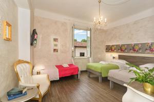 Postel nebo postele na pokoji v ubytování B&B Relais Inn Lucca