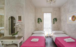 Postel nebo postele na pokoji v ubytování B&B Relais Inn Lucca