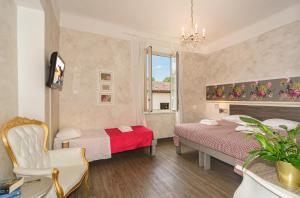 Postel nebo postele na pokoji v ubytování B&B Relais Inn Lucca