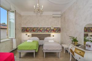 Postel nebo postele na pokoji v ubytování B&B Relais Inn Lucca