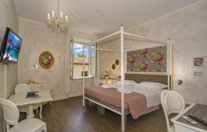 Postel nebo postele na pokoji v ubytování B&B Relais Inn Lucca