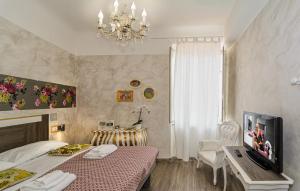 Postel nebo postele na pokoji v ubytování B&B Relais Inn Lucca