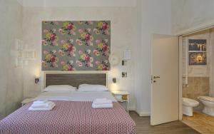 Postel nebo postele na pokoji v ubytování B&B Relais Inn Lucca
