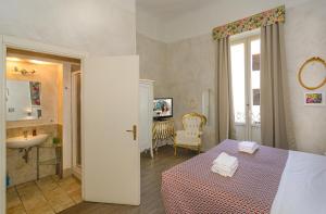 Postel nebo postele na pokoji v ubytování B&B Relais Inn Lucca