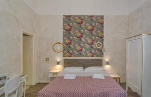 Postel nebo postele na pokoji v ubytování B&B Relais Inn Lucca