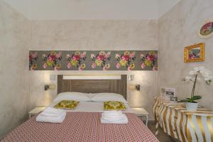Postel nebo postele na pokoji v ubytování B&B Relais Inn Lucca