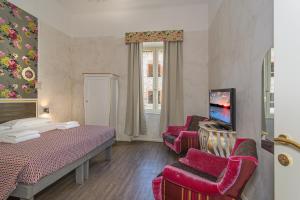 TV a/nebo společenská místnost v ubytování B&B Relais Inn Lucca