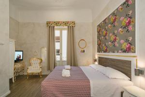 Postel nebo postele na pokoji v ubytování B&B Relais Inn Lucca