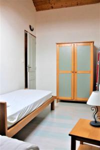 Posteľ alebo postele v izbe v ubytovaní Maison chaleureuse à Vaucluse avec jardin spacieux 84 m²