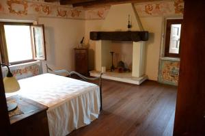 Postel nebo postele na pokoji v ubytování Agriturismo Ronchi Di Sant'Egidio