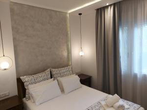 Posteľ alebo postele v izbe v ubytovaní SUN RESIDENCE Exclusive Seaside Suites