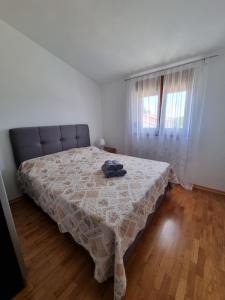 Postel nebo postele na pokoji v ubytování Sunny apartment with pool + 15 fotografií