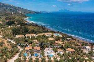 an aerial view of a house on the beach at Villa Ionio Deste by Villa Plus in Vasilikos