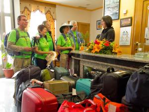 a group of people standing next to a pile of luggage at Hotel Restaurante Xaneiro in Melide